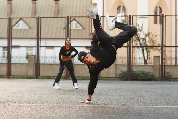 Handsome guy in a stylish black clothes dancing hip-hop. dancer — Stock Photo, Image