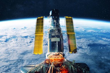 Dünya 'nın yörüngesindeki altın güneş panellerine sahip uzay teleskopu, gezegenin ve evrenin güzelliğini yakalıyor, bilimi, keşfi ve gelişmiş uzay teknolojisini sembolize ediyor. ISS