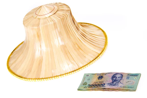 Vietnamesiska pengar, dong med asiatisk stil hatt — Stockfoto