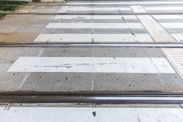 Rail of the tram lean together with crosswalk — Stock Photo, Image