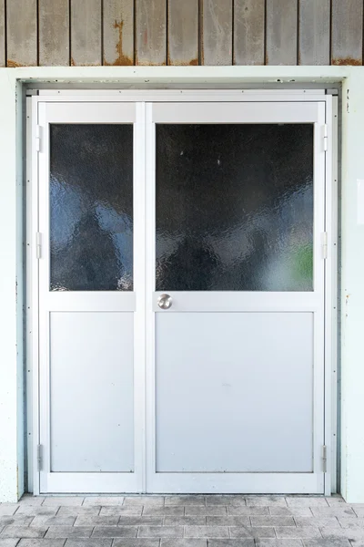 Porta feita de alumínio com janela preta — Fotografia de Stock