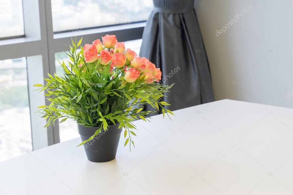 Bouquet Of Plastic Flowers Placed On The Desk Stock Photo