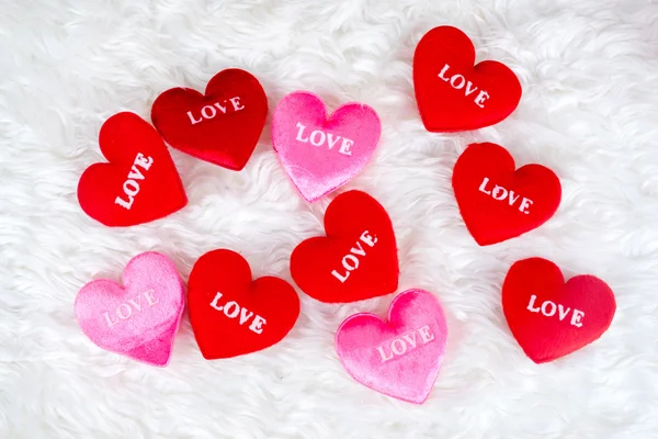 Decorated gifts with a heart shapes and text "love" — Stock Photo, Image