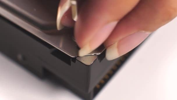 Technician are repairing a harddisk by using a screwdriver to close, assembled a part of drive back again — Stock Video