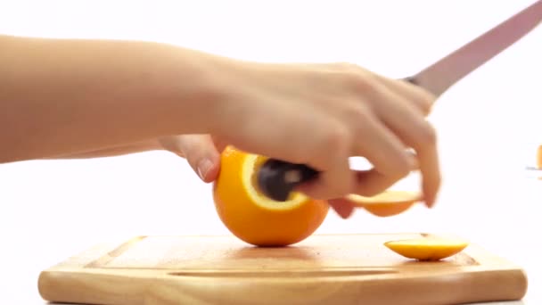 Fresh orange cut into pieces — Stock Video