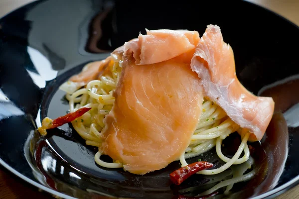 Smoked salmon and spicy pasta — Stock Photo, Image