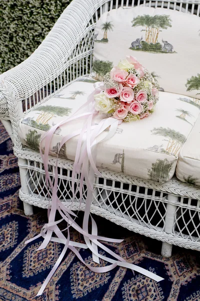 Bouquet of pink roses on sofa — Stock Photo, Image