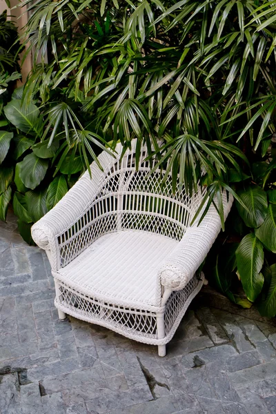 Rattan chair with green trees at outdoor — Stock Photo, Image