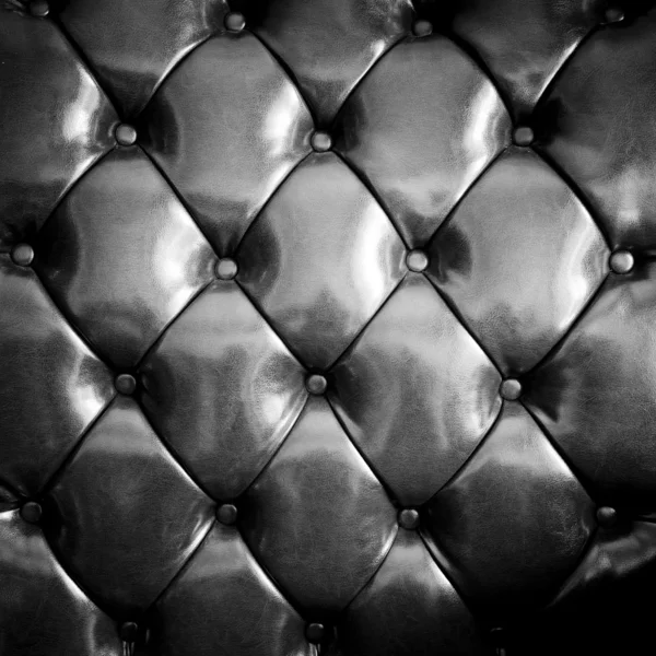 Close up black luxury buttoned leather — Stock Photo, Image