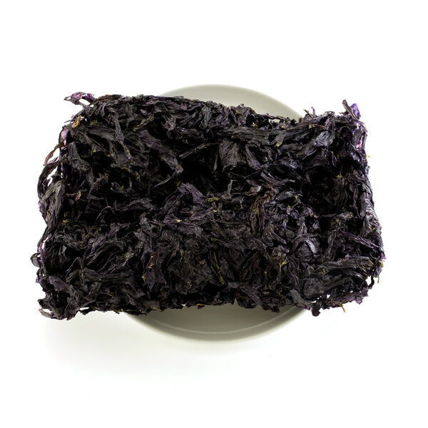 Dried black seaweed close up Isolated on white background