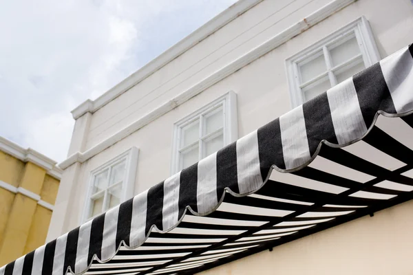 Black and white striped sunblinds — Stock Photo, Image