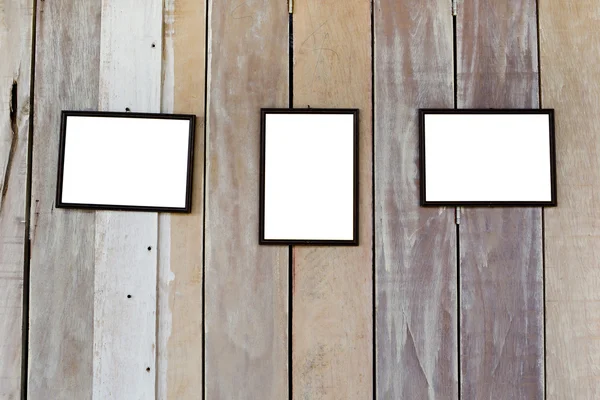 Three blank frame on wood wall — Stock Photo, Image