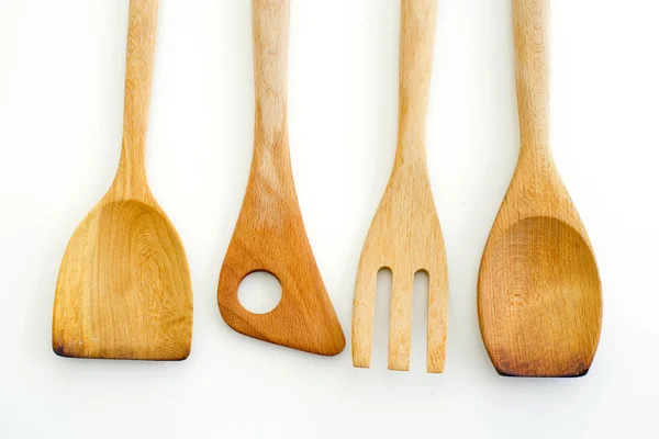 Una collezione di utensili da cucina in legno isolati su fondo biancogr — Foto Stock