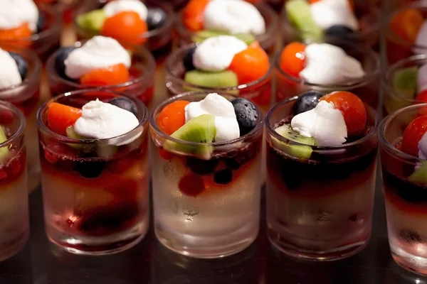 Delicious cream and fruit dessert close up — Stock Photo, Image