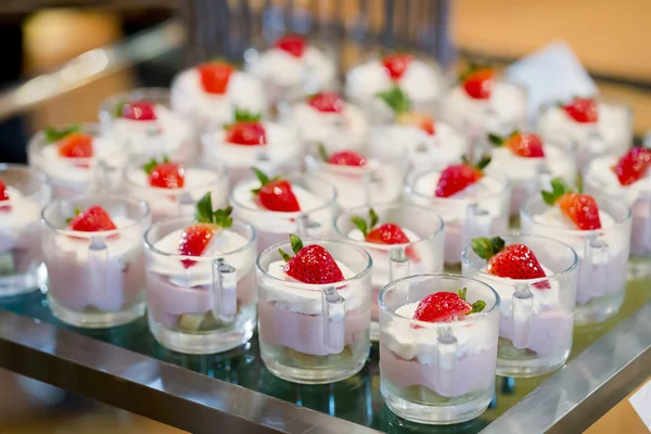 Many servings of sweet tasty dessert on buffet — Stock Photo, Image