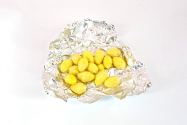 Lotus tohumlar folyo üzerinde beyaz arka plan üzerinde izole