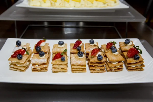 Stack of crispy pancake with banana slice topping of strawberry, — Stock Photo, Image