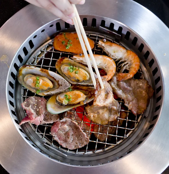 Mixed Roasted Meat and Seafood and Chopsticks on the BBQ Grill o — Stock Photo, Image