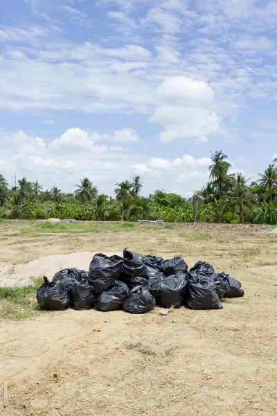 Garage dump of black trash bags. — Stock Photo, Image