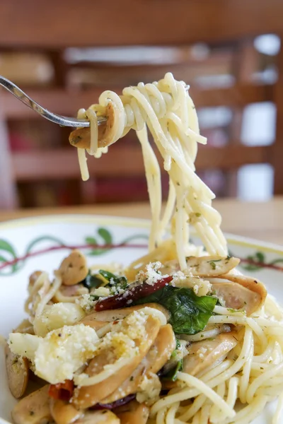 Fork with Spicy Spaghetti with sausage — Stock Photo, Image