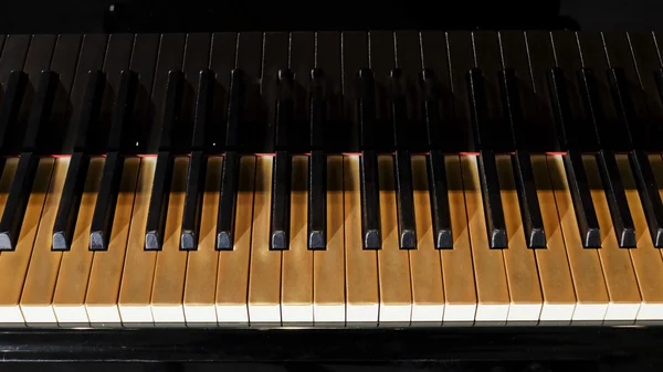 Piano keys on black piano — Stock Photo, Image