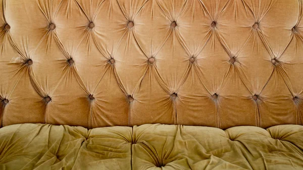 Textura de fundo sofá marrom com botões afundados — Fotografia de Stock