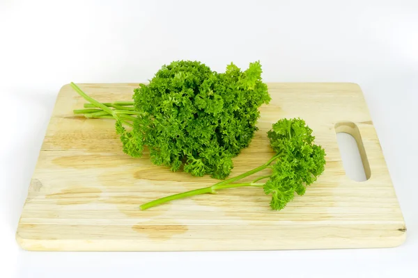 Perejil en la tabla de cortar — Foto de Stock