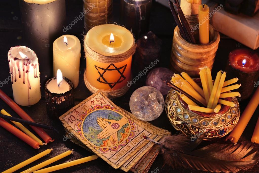 https://st2.depositphotos.com/3325457/10295/i/950/depositphotos_102955792-stock-photo-magic-objects-candles-and-tarot.jpg