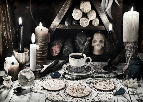 Fortunte telling ritual with magic objects, candles and crystals. Esoteric, gothic and occult background, Halloween mystic concept.