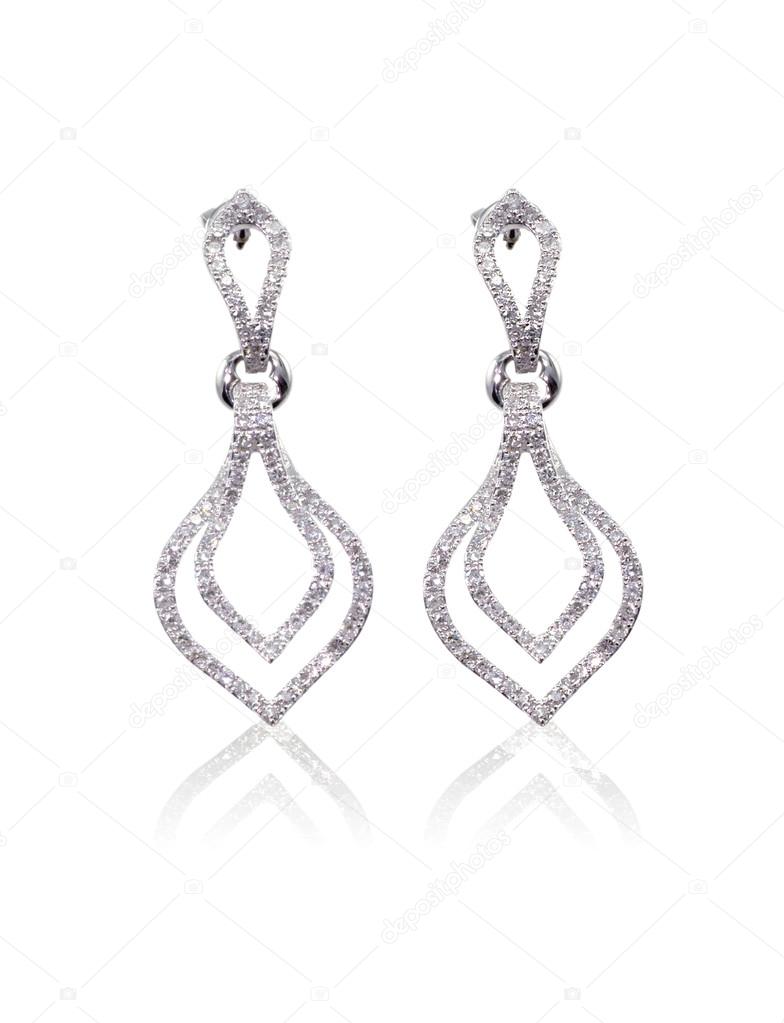 Diamond dangle drop earrings isolated on white