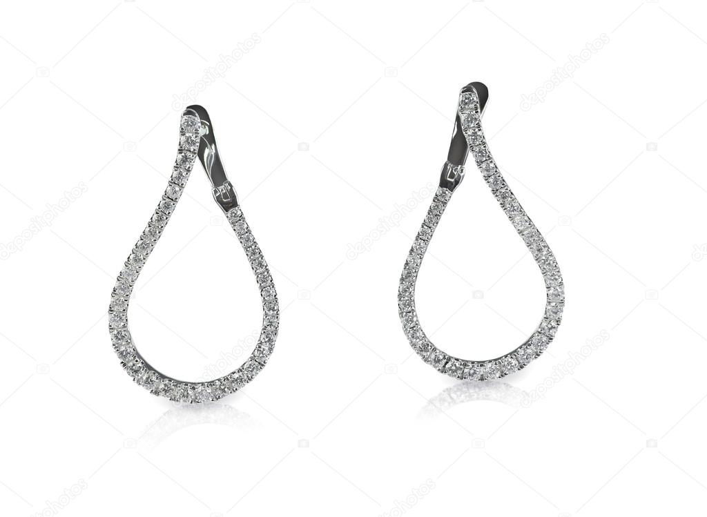 Diamond dangle drop earrings isolated on white