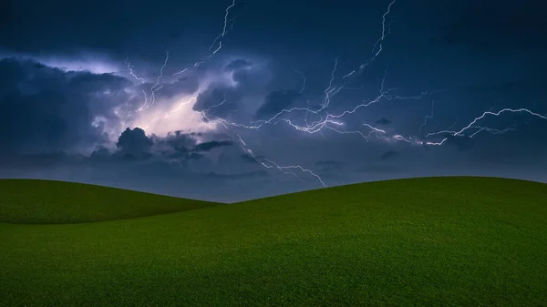 Lightning Storm.Thunderstorm with lightning in a green meadow.