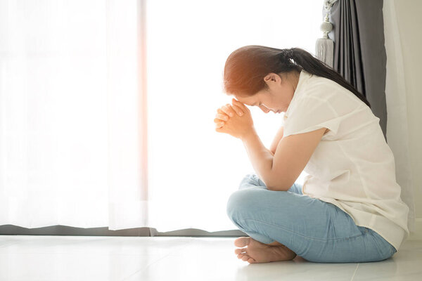 Christian life crisis prayer to god. Woman Pray for god blessing to wishing have a better life. woman hands praying to god with the bible. begging for forgiveness and believe in goodness.