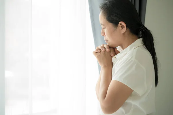 Christian life crisis prayer to god. Woman Pray for god blessing to wishing have a better life. woman hands praying to god. begging for forgiveness and believe in goodness.