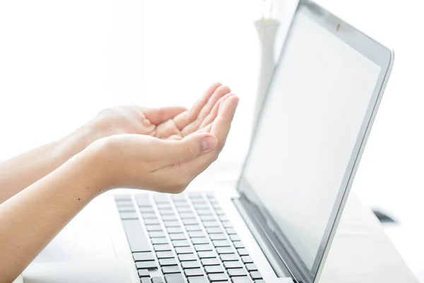 Asian girl praying with computer laptop, Church services new normal concept, Home church during quarantine coronavirus Covid-19, Online church from home concept, spirituality and religion