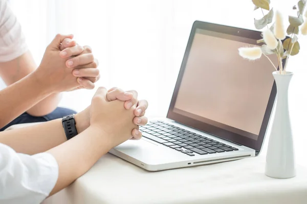 Asian girl praying with computer laptop, Church services new normal concept, Home church during quarantine coronavirus Covid-19, Online church from home concept, spirituality and religion