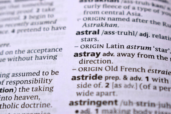 Close Up Of English Dictionary Page With Word - astray