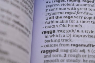 English Dictionary Book Page Close Up With The Word Transcription Of -ragga