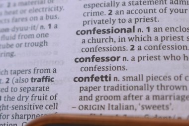 English Dictionary Book Page Close Up With The Word Transcription Of -confessional
