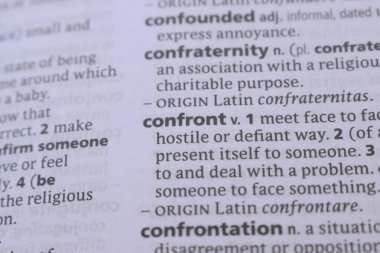 Close Up Of English Explanation Dictionary Word Of - confront