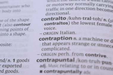 English Dictionary Book Page Close Up With The Word Definition Of - contraption