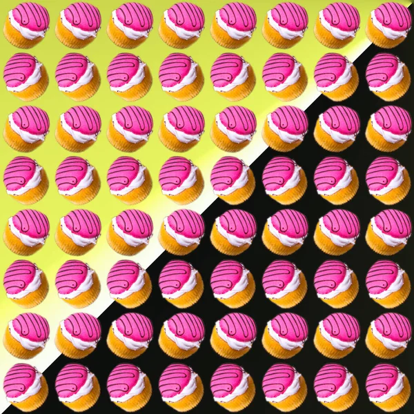 Cupcakes Mit Weißer Und Pinkfarbener Creme Auf Gelb Schwarzem Hintergrund — Stockfoto