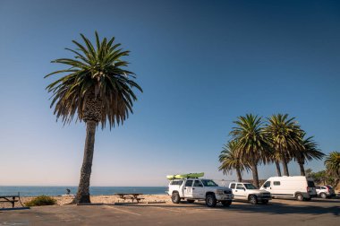 Cars parked at Refugio State Beach, California.  clipart