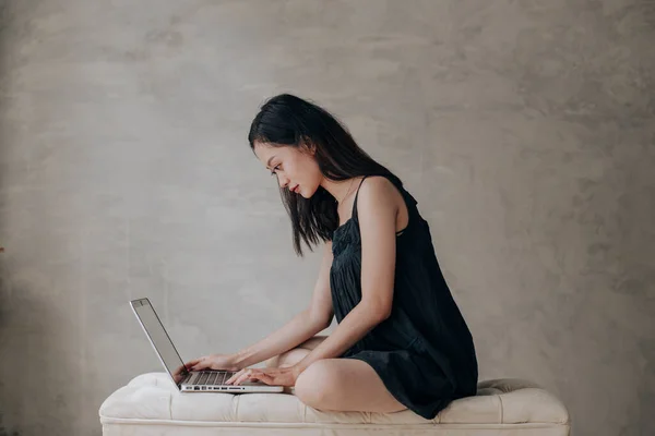 Asian beautiful woman thinking idea with laptop computer