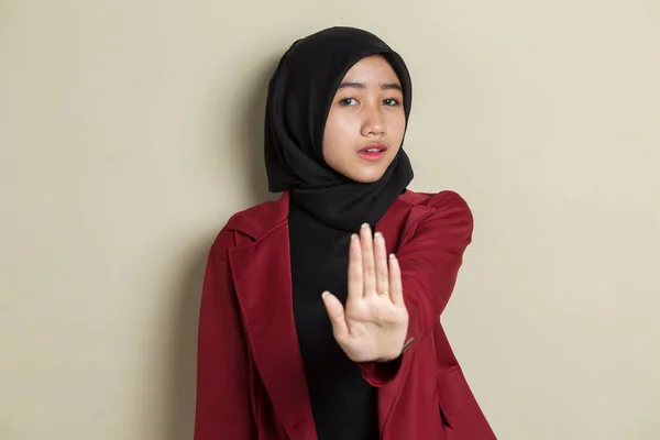 Asian muslim hijab woman show stop hands gesture