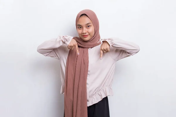 Happy Young Asian Muslim Woman Pointing Fingers Different Directions Isolated — Stok Foto