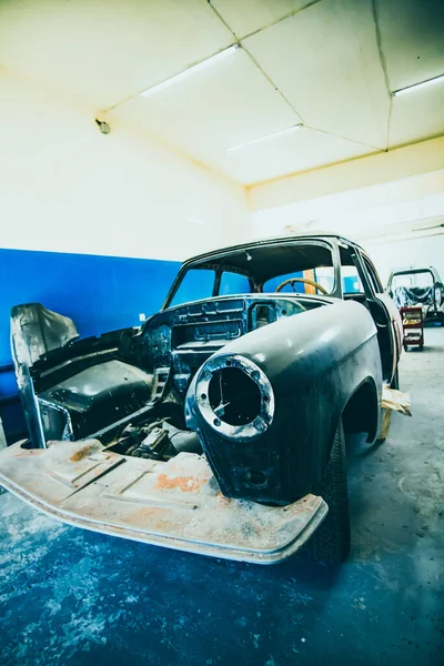 Old Soviet cars in disassembled condition, the body of old rare cars