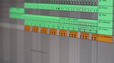 Close-up of a screen displaying music being produced