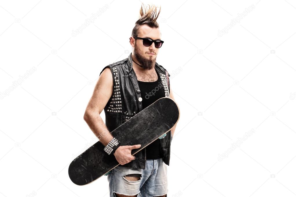 Punk rocker holding a skateboard 