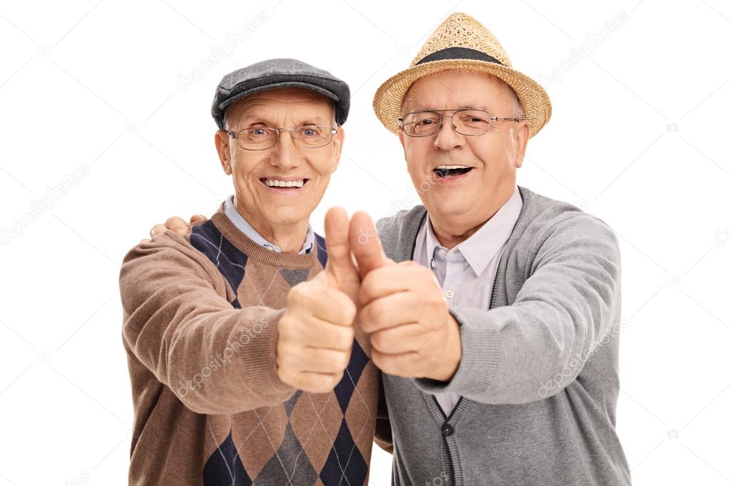 Two old friends giving thumbs up 